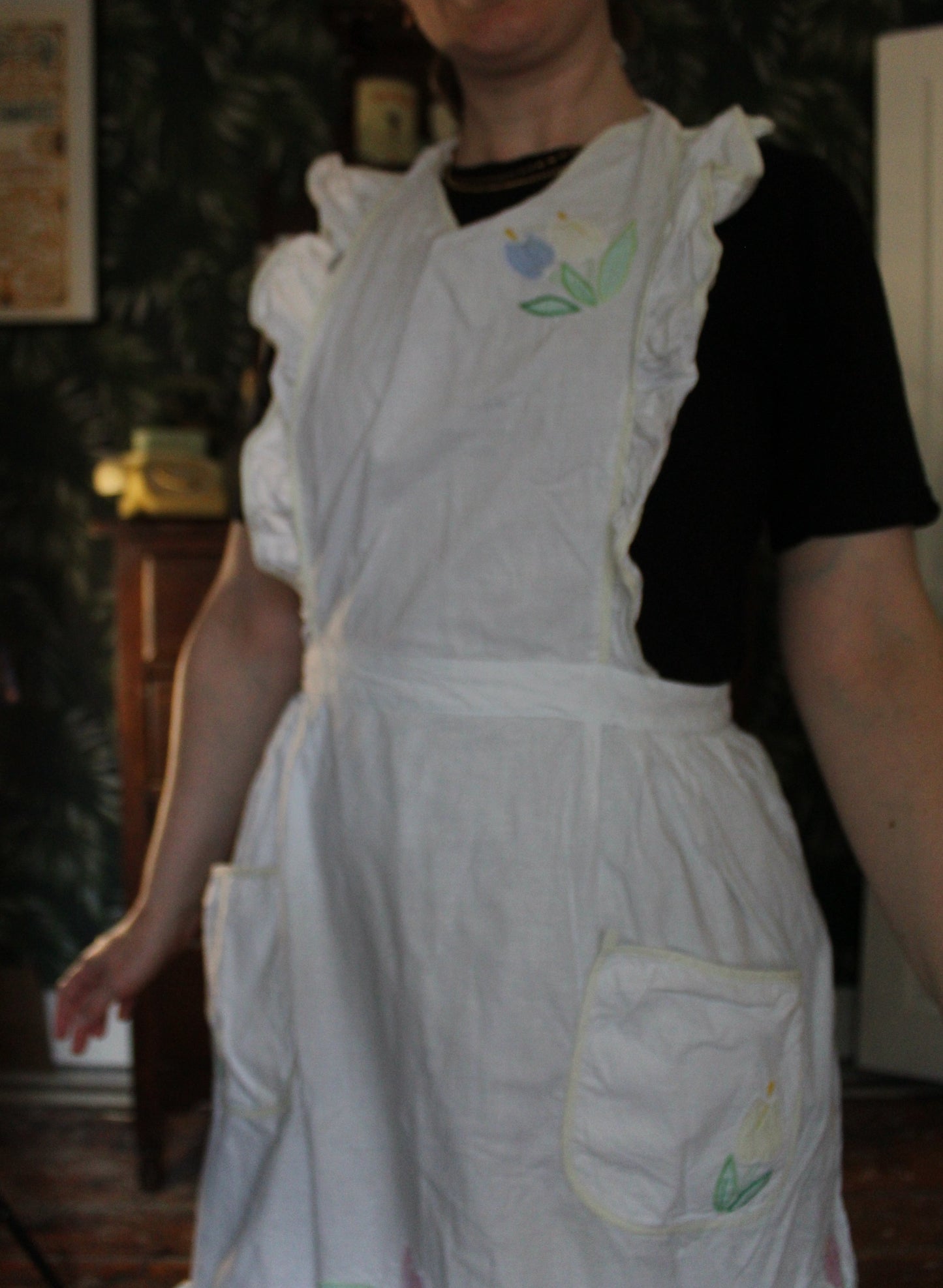White frilly apron with floral panels