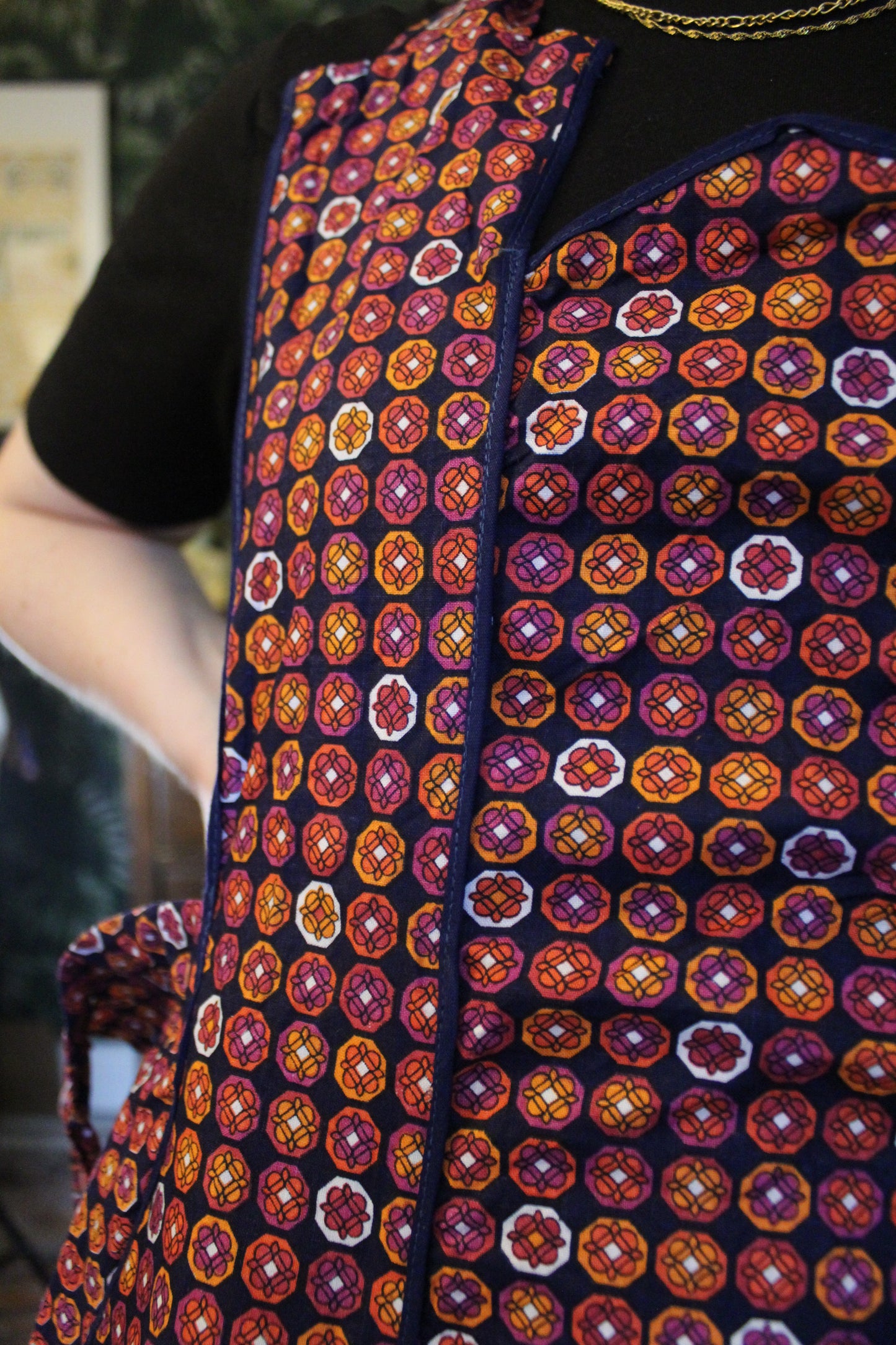 Navy apron with pinky orange floral prints