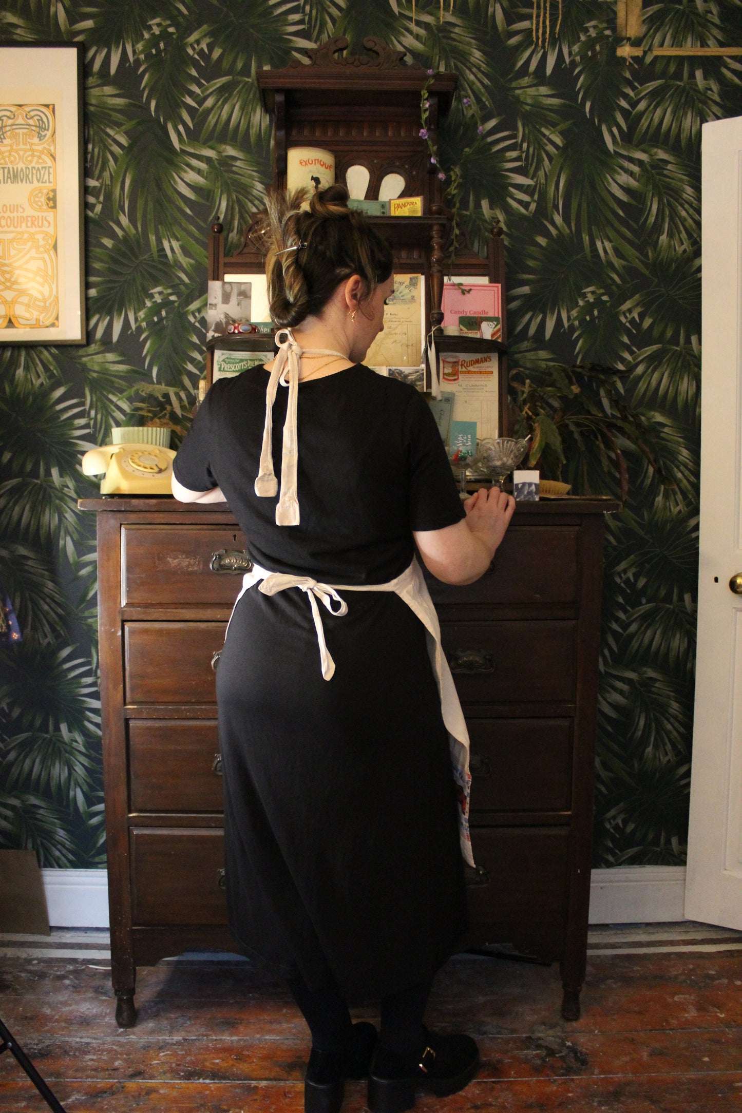 Cream canvas apron with blue and red embroidered details