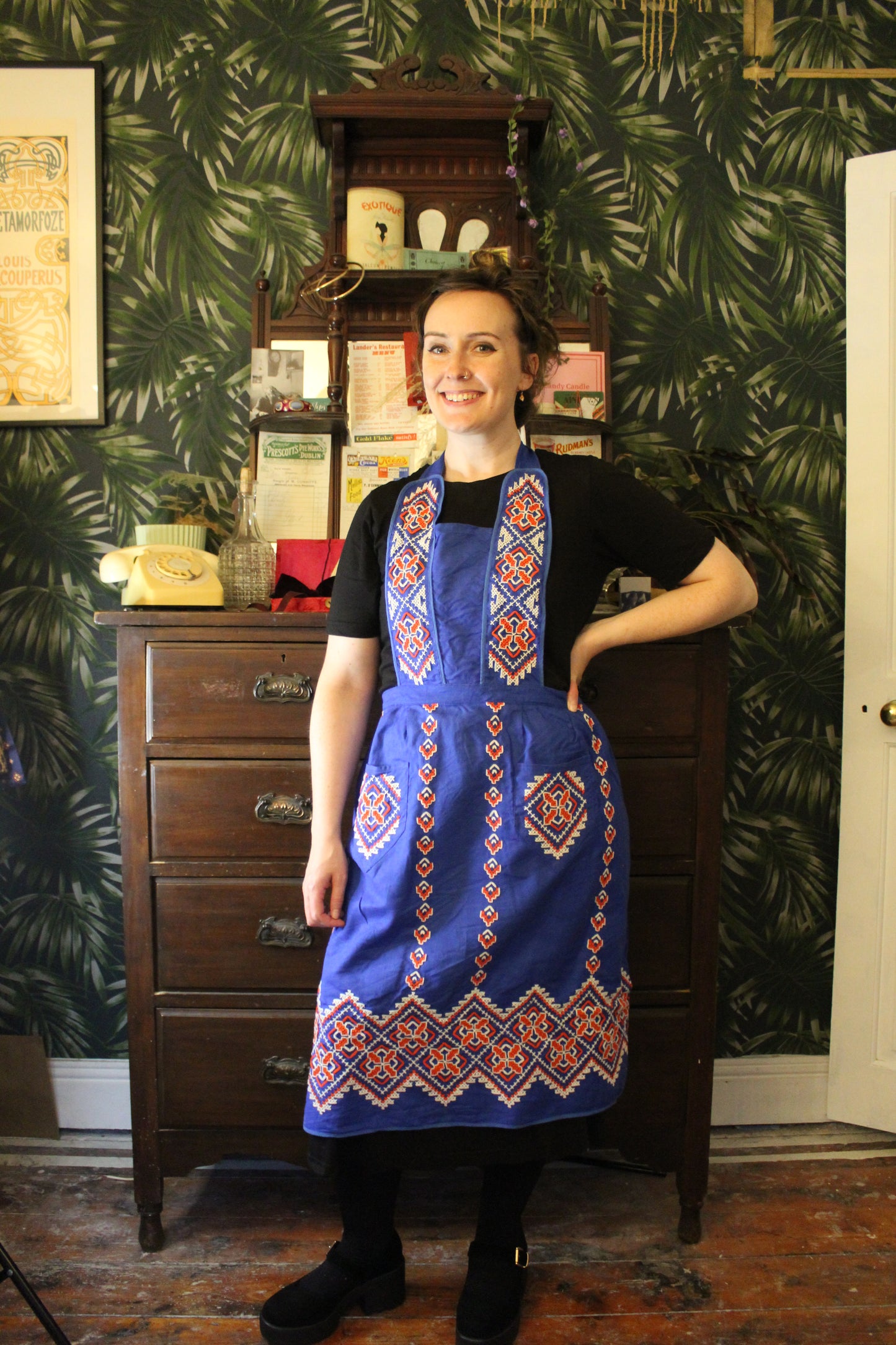 Cobalt blue apron with red and white embroidery
