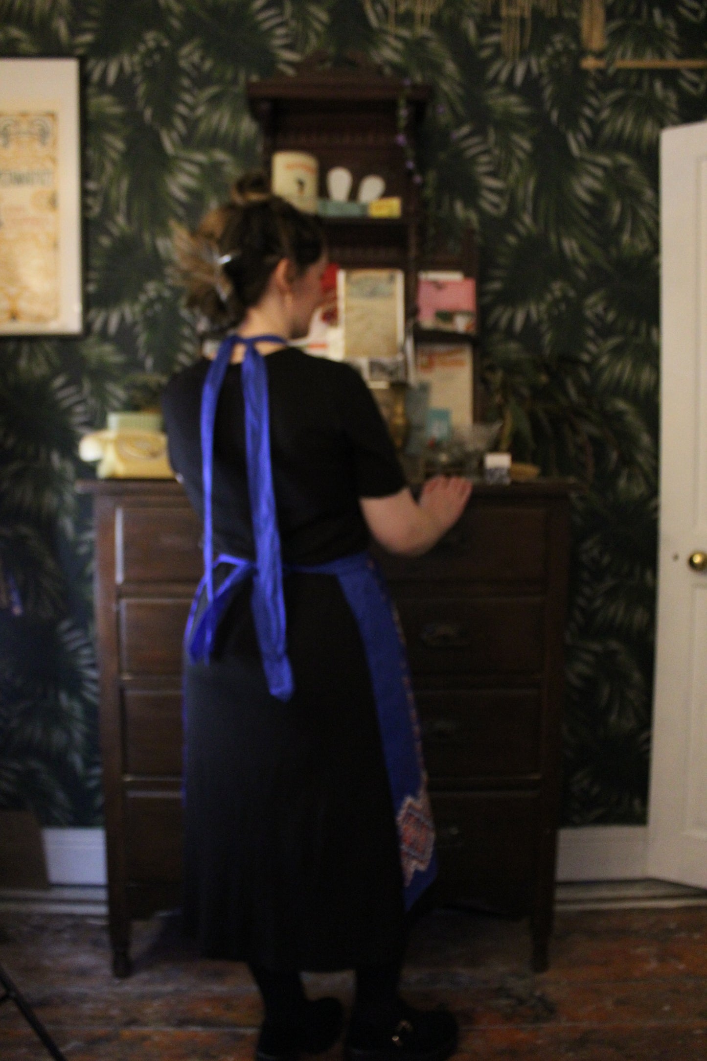 Cobalt blue apron with red and white embroidery