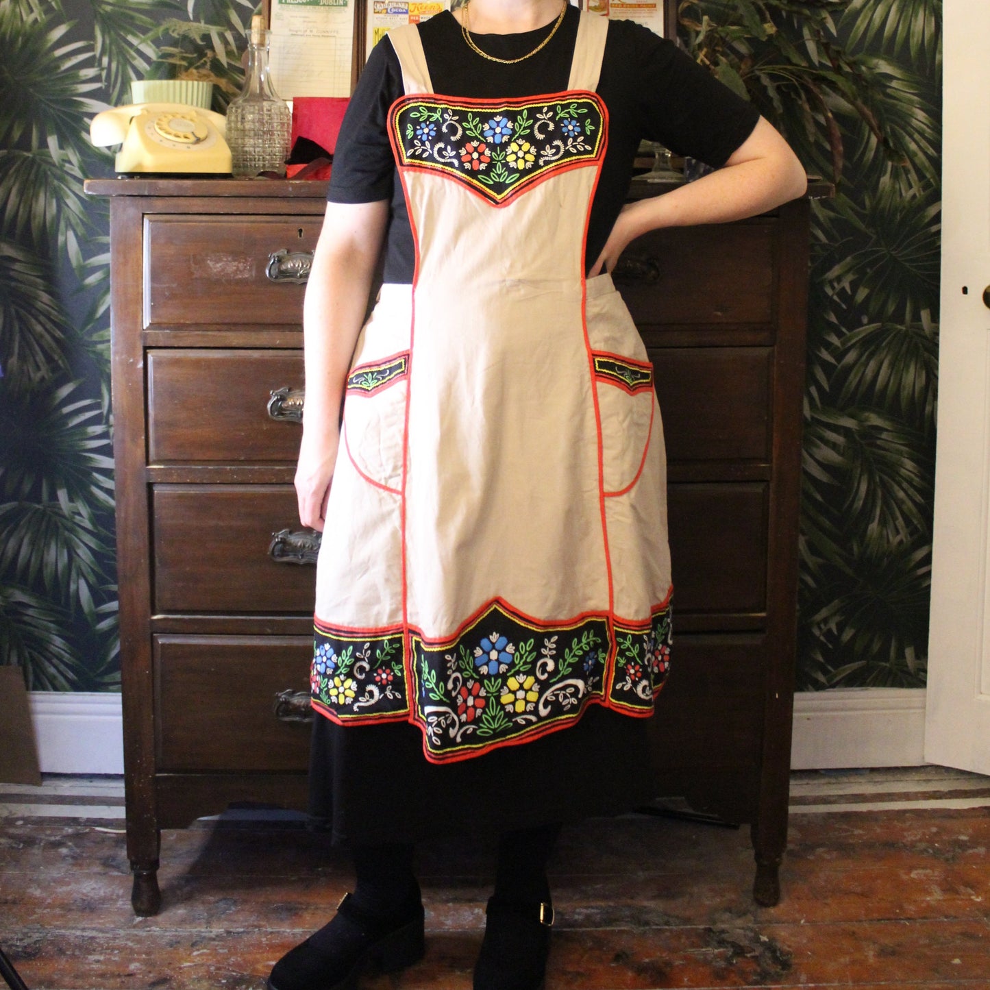 Canvas apron with black floral panels