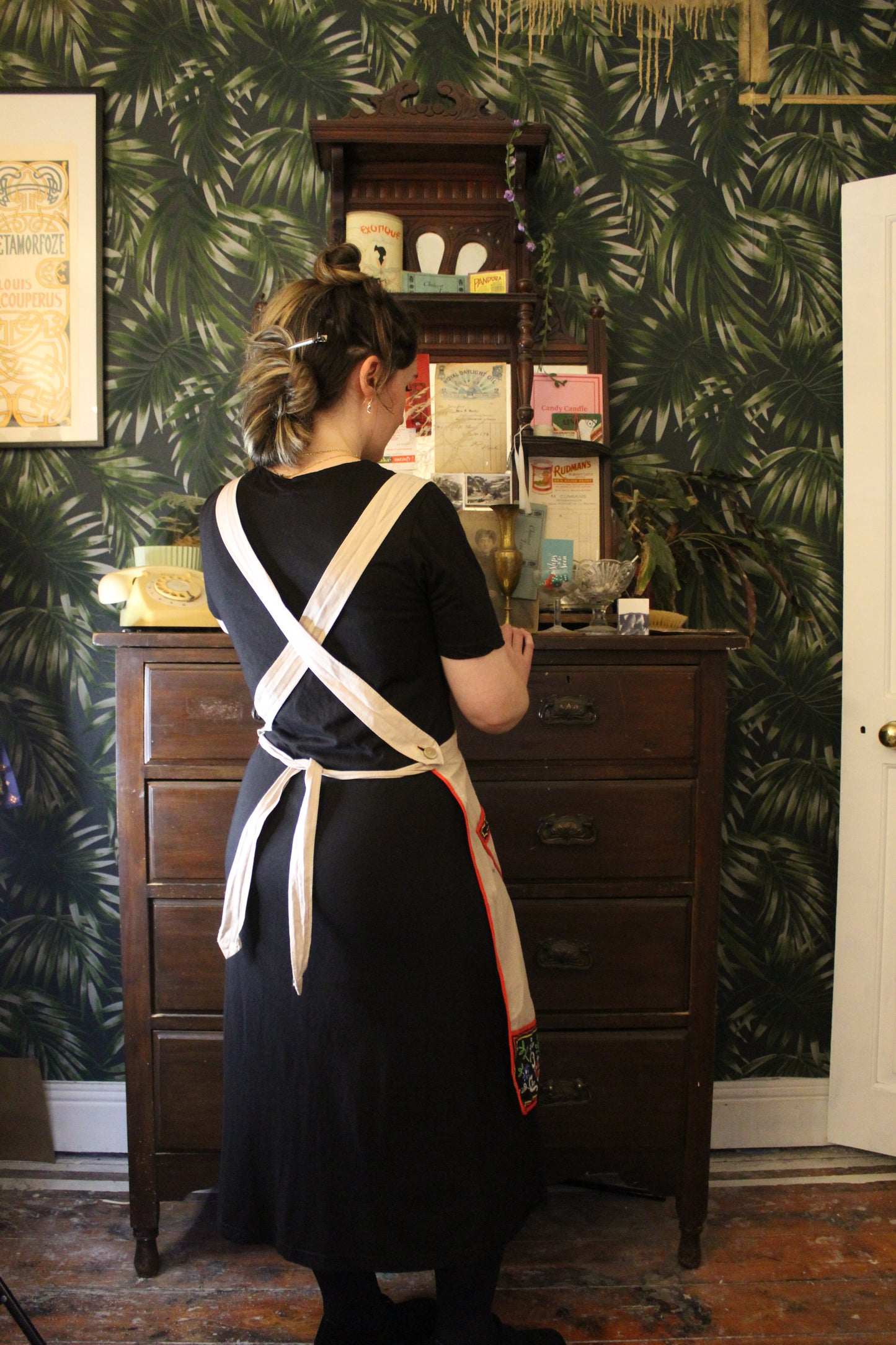 Canvas apron with black floral panels