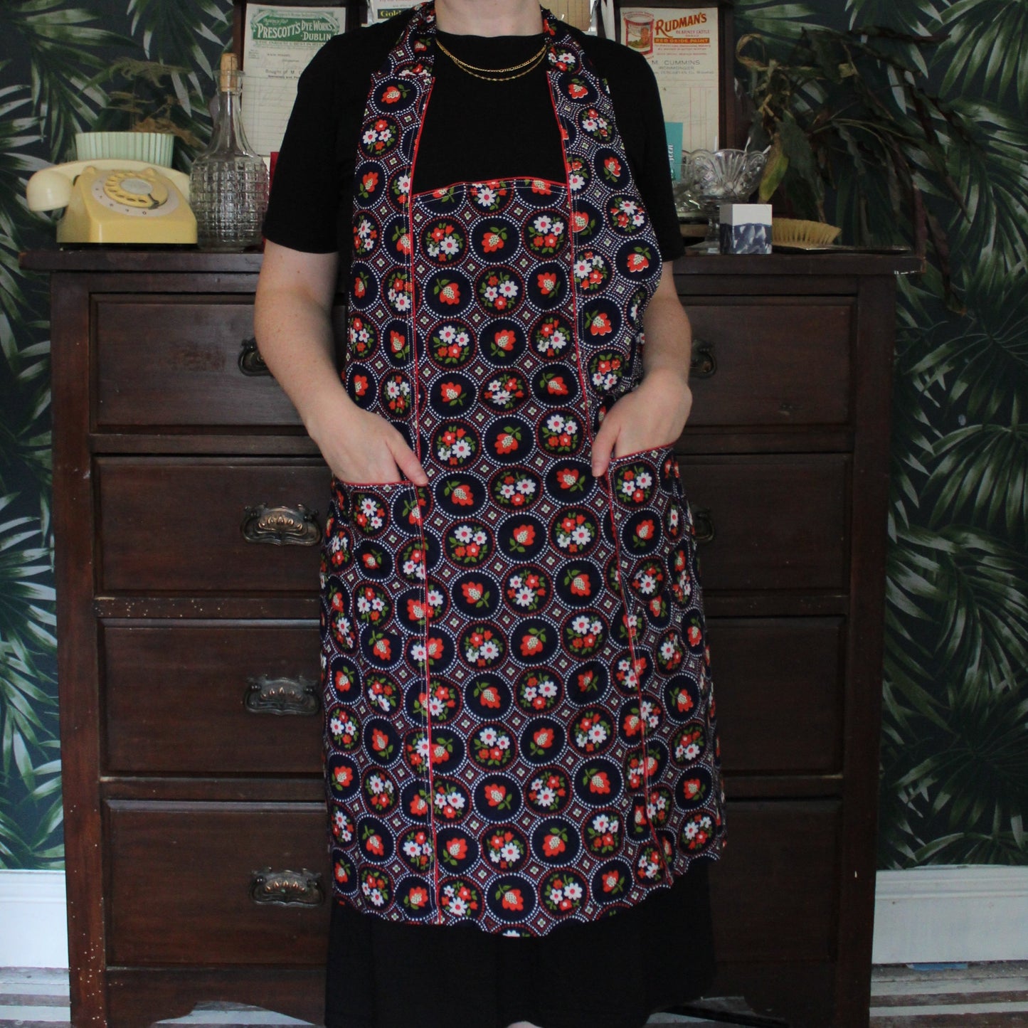 Navy-indigo apron with red posy pattern