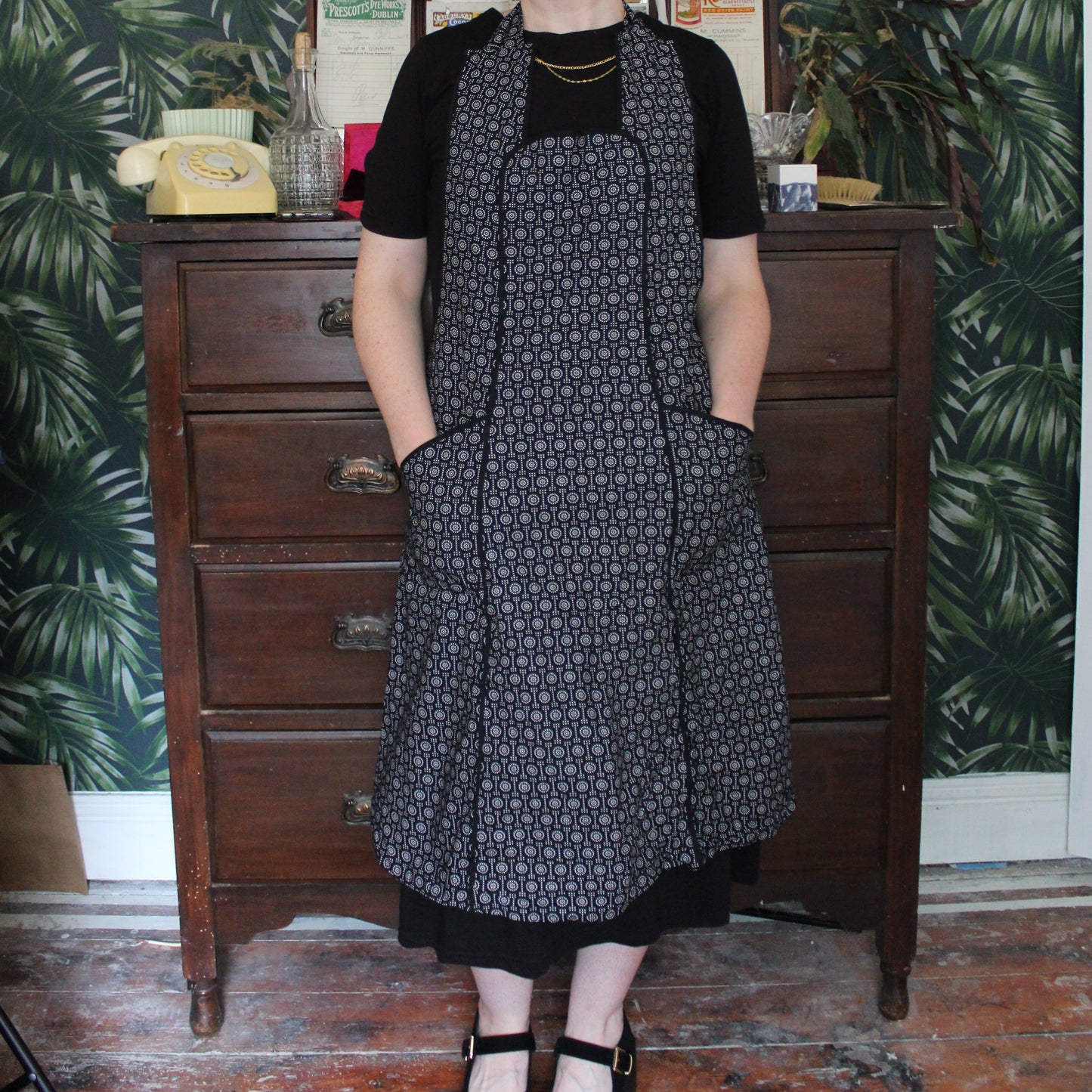 Black apron with white dot pattern