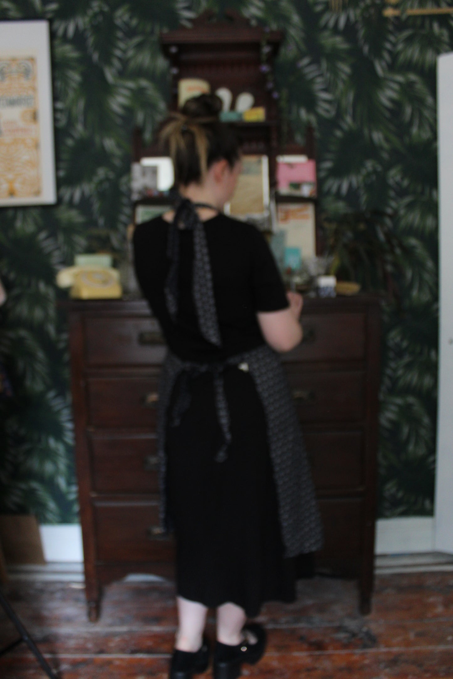 Black apron with white dot pattern