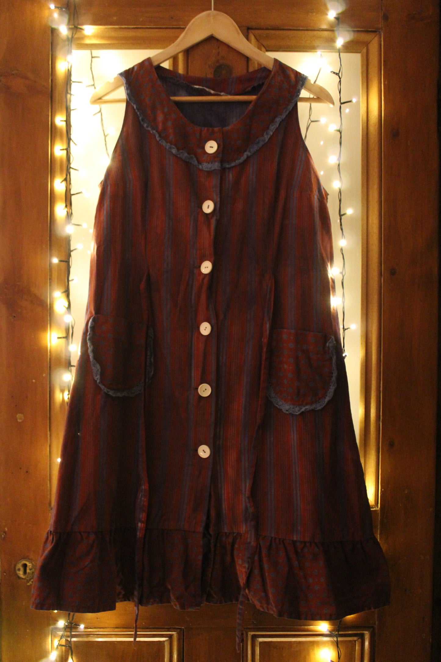 Wine and blue striped apron with white buttons