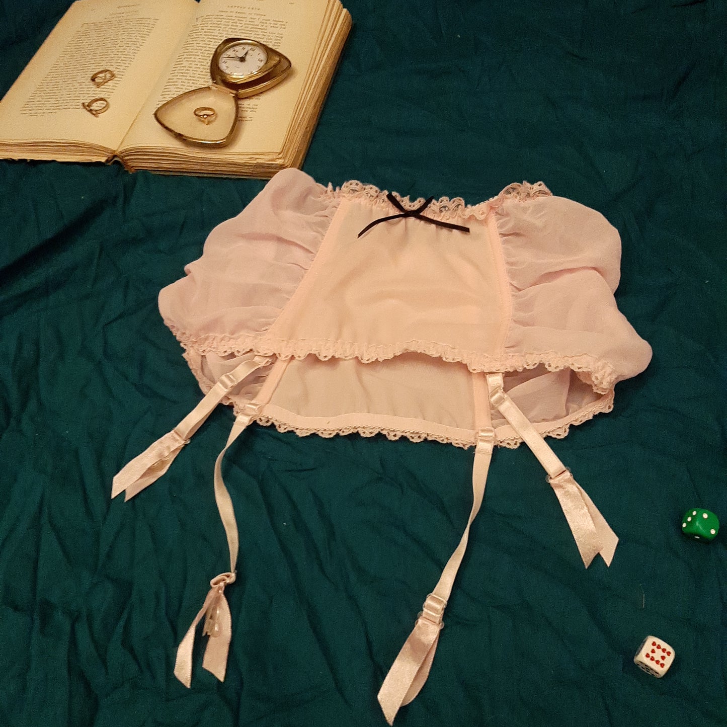 Pink garter belt with black ribbon detail