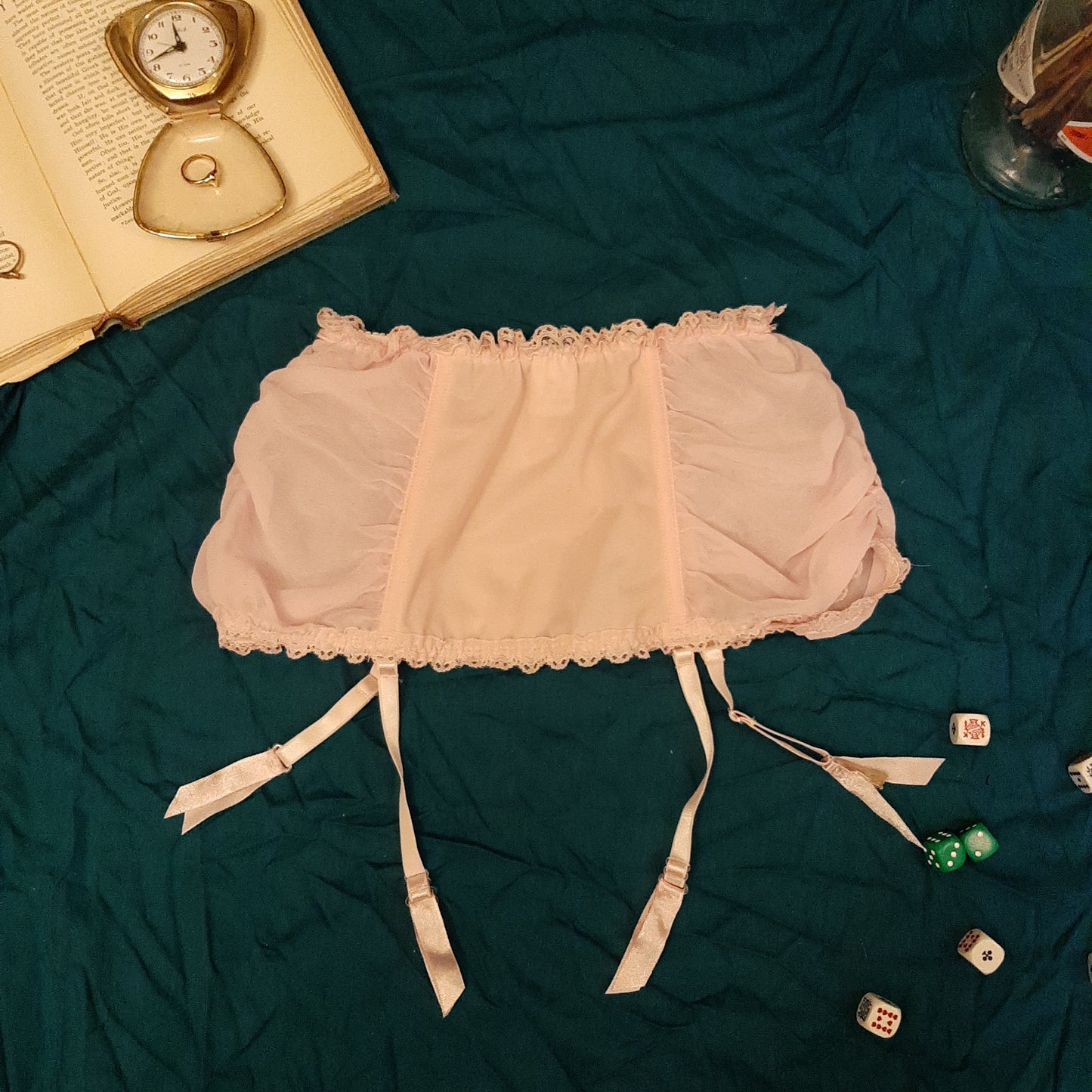 Pink garter belt with black ribbon detail