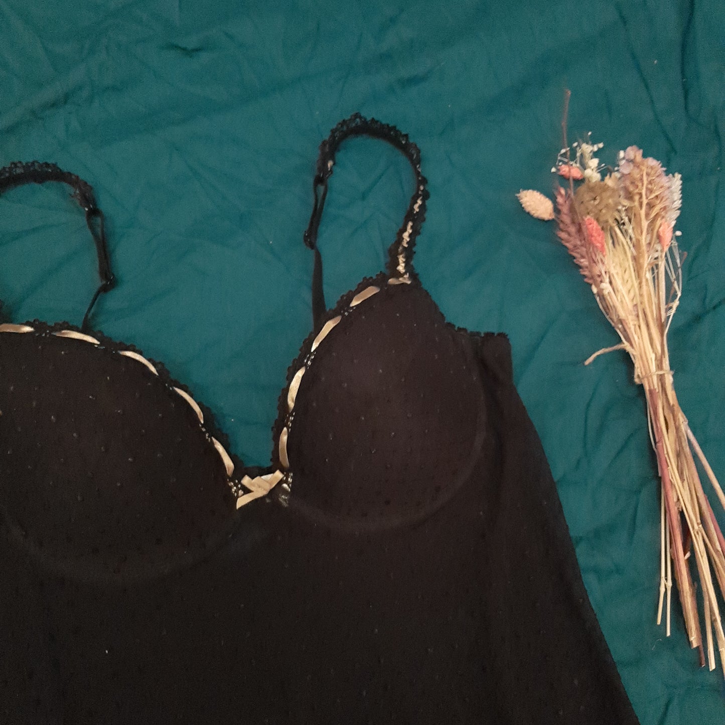 Black slip with dappled pattern and pink ribbon