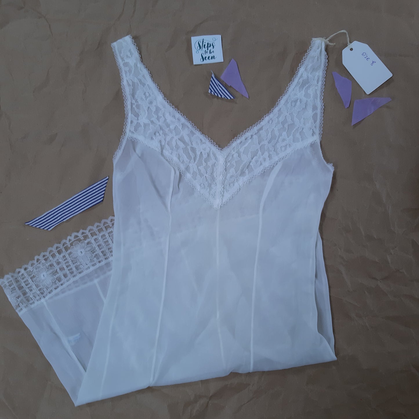 Vee neck white slip with lace trim