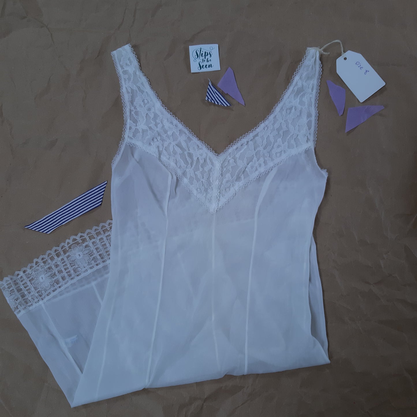 Vee neck white slip with lace trim