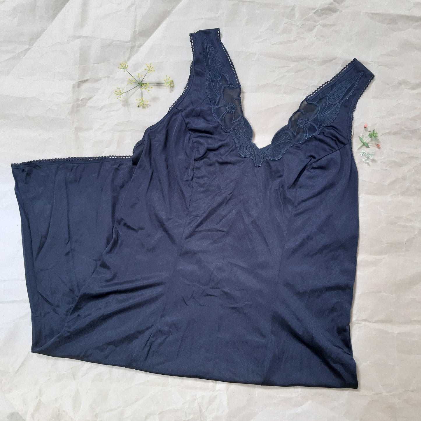 Black slip with woven floral trim