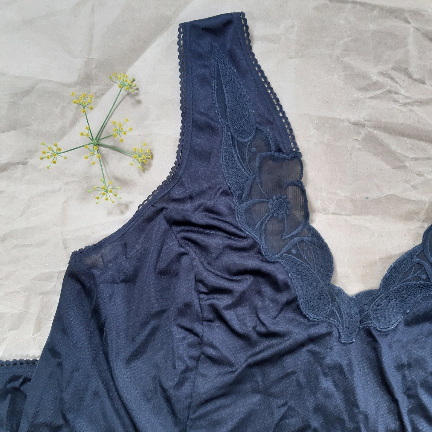 Black slip with woven floral trim