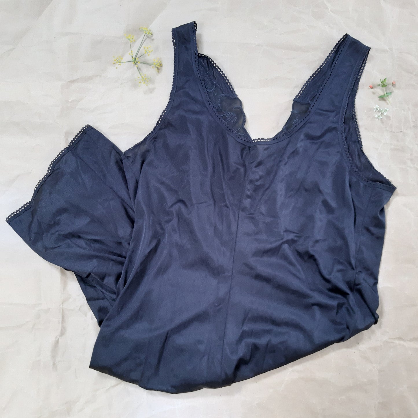 Black slip with woven floral trim