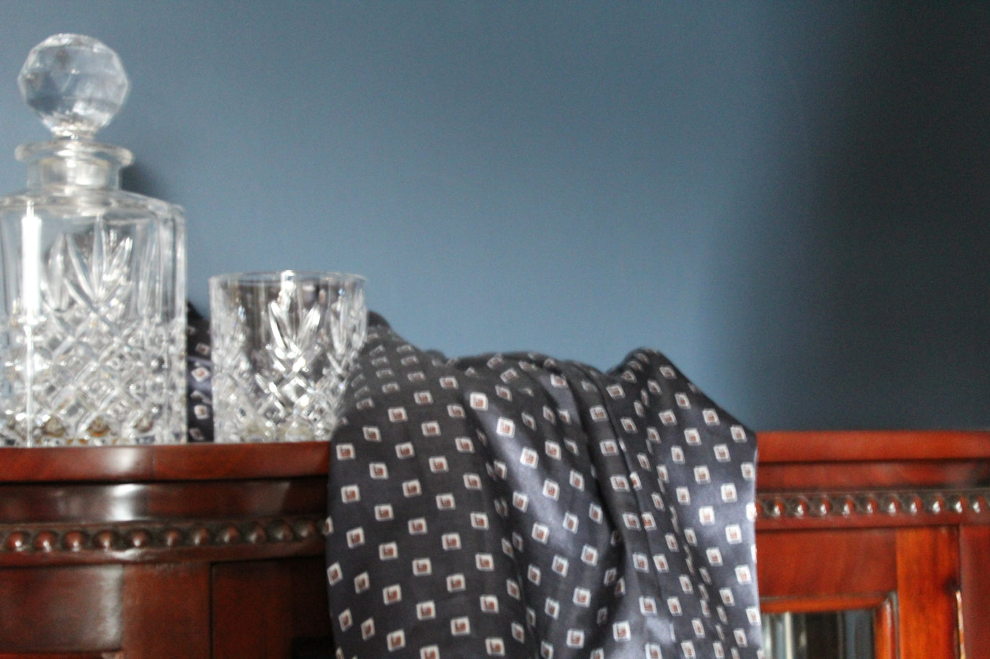 Navy blue robe with white and red box embellishments