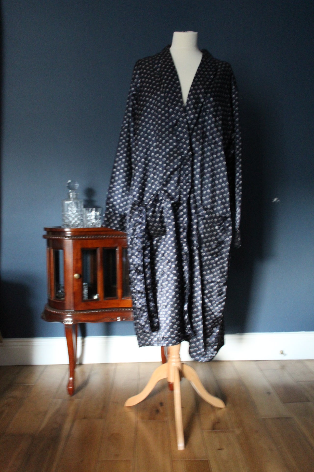 Navy blue robe with white and red box embellishments