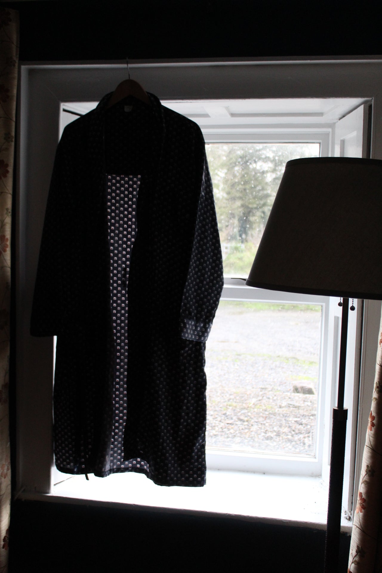 Navy blue robe with white and red box embellishments