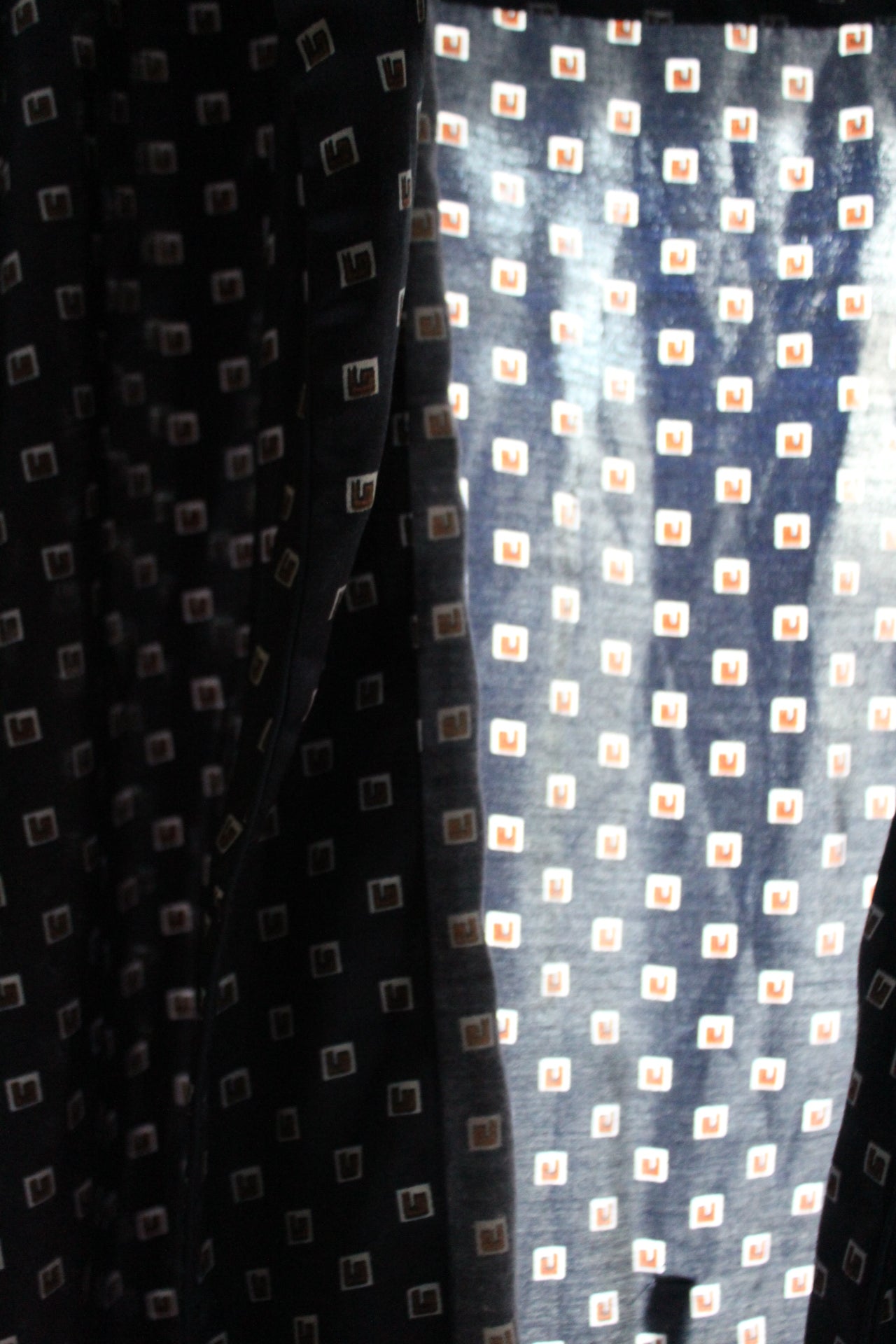 Navy blue robe with white and red box embellishments