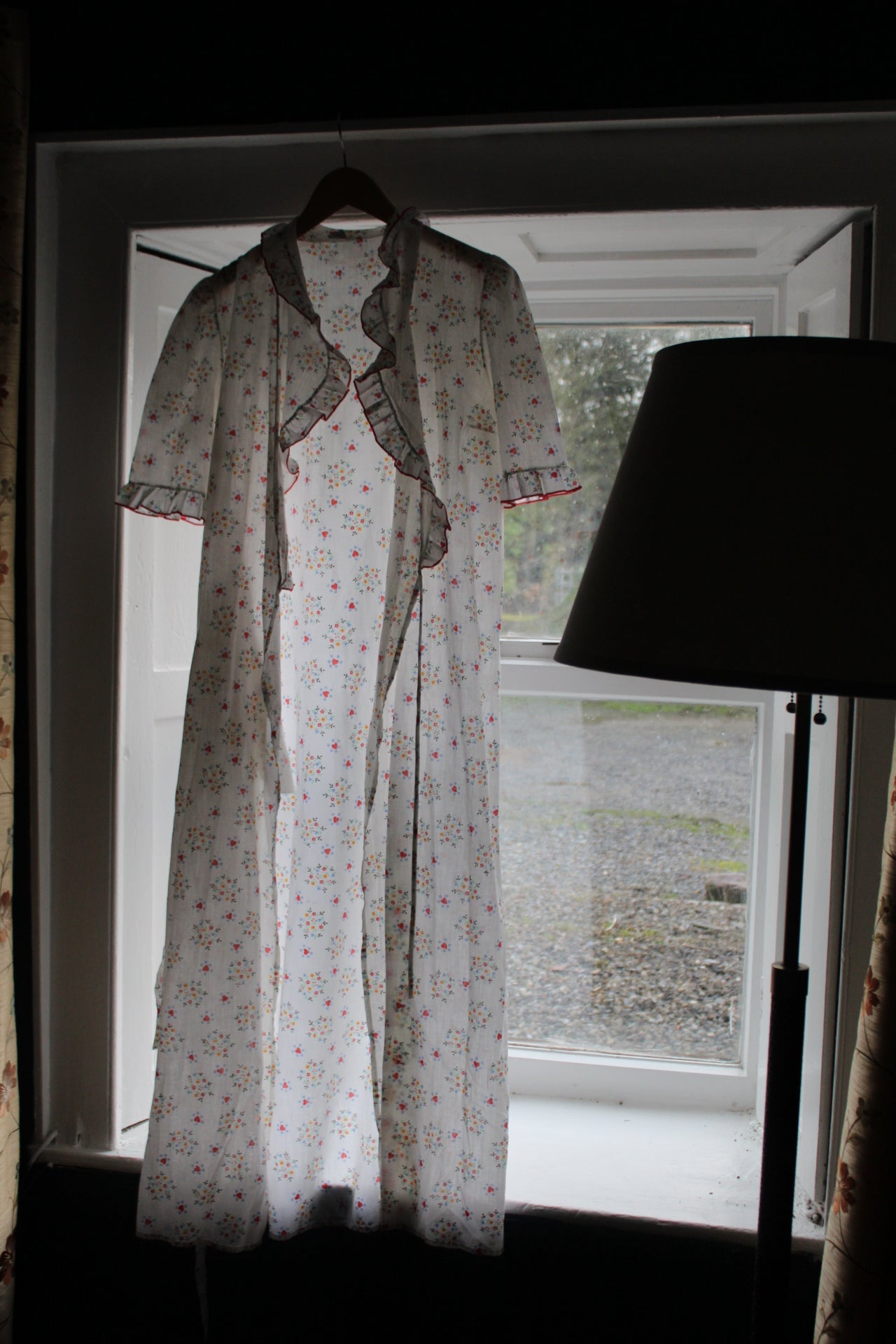 White robe with red heart and flower design