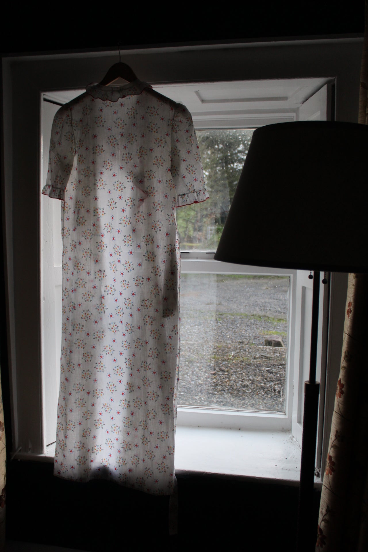 White robe with red heart and flower design