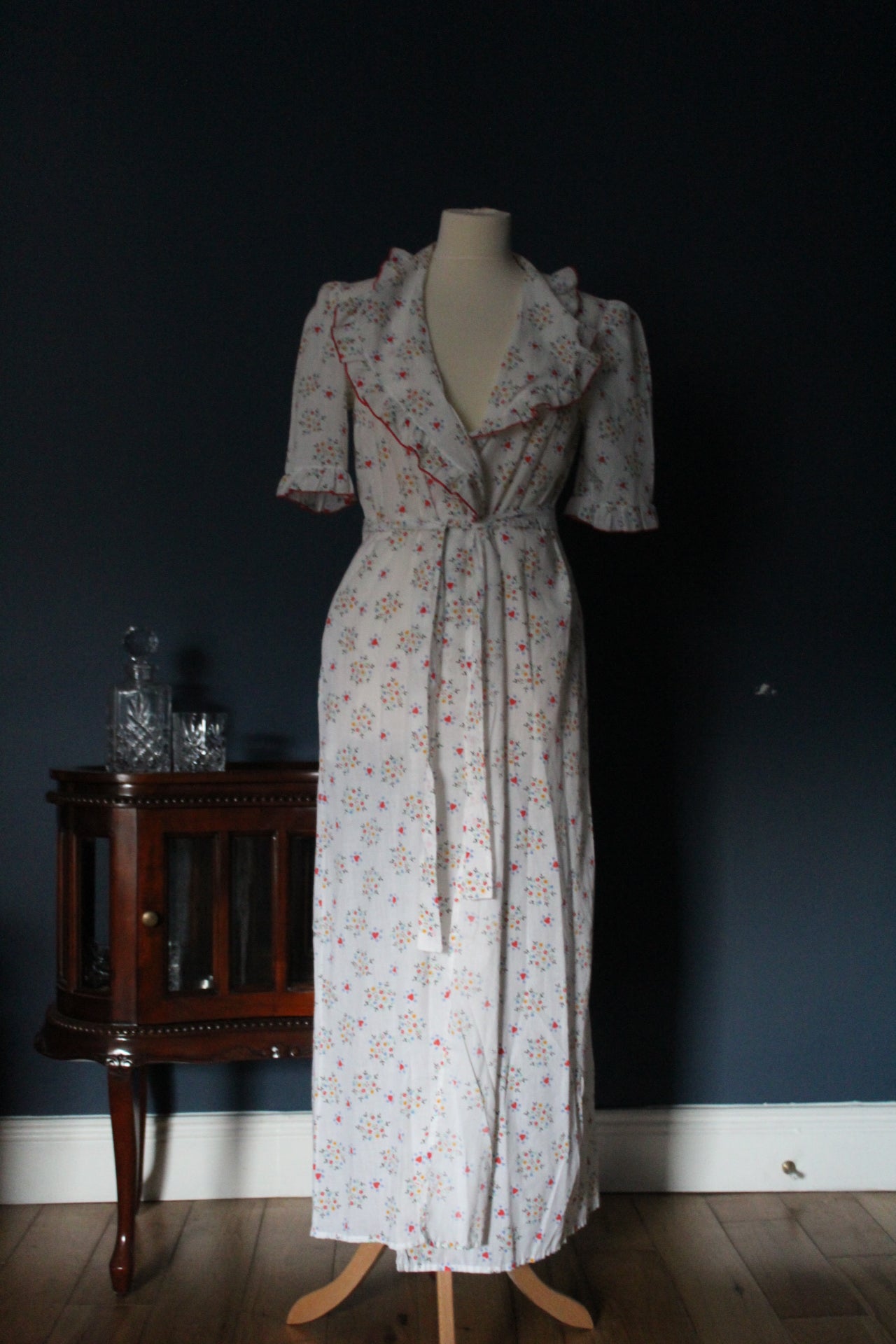 White robe with red heart and flower design