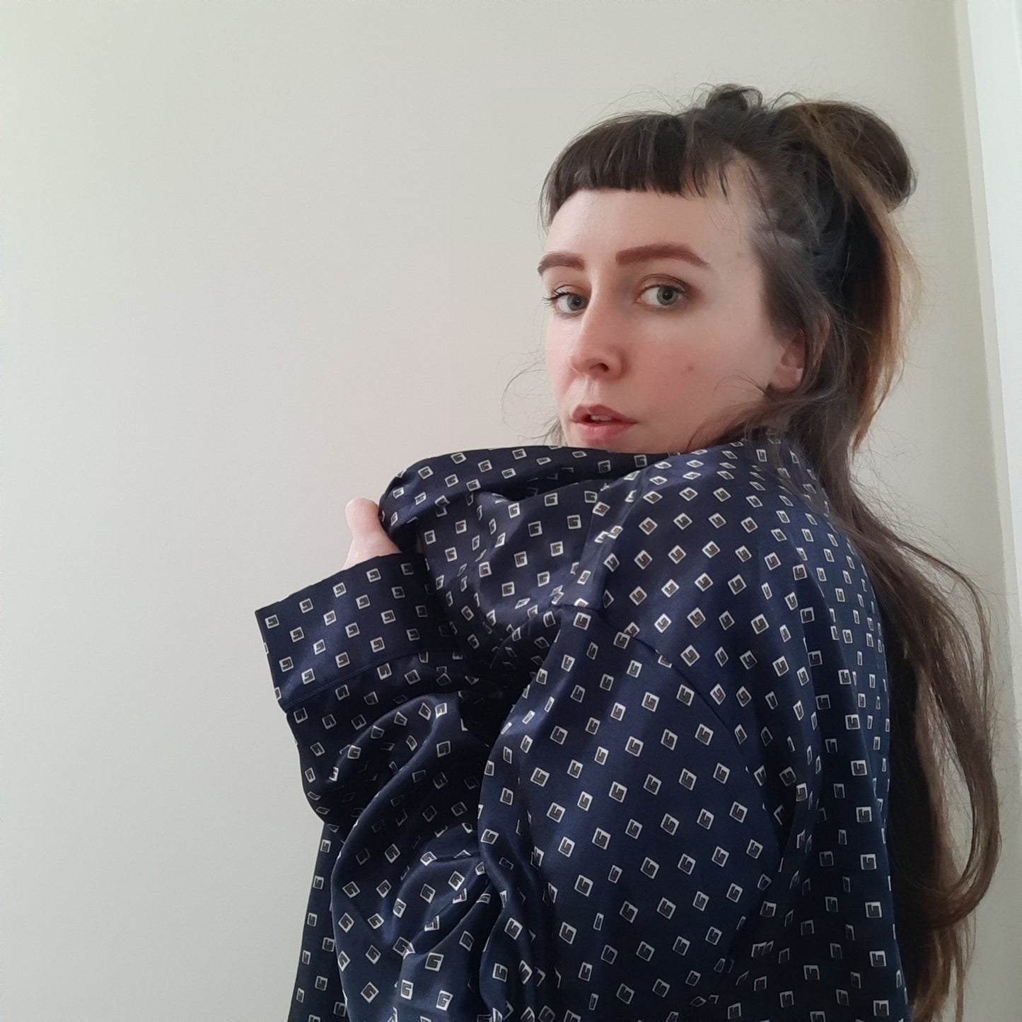 Navy blue robe with white and red box embellishments