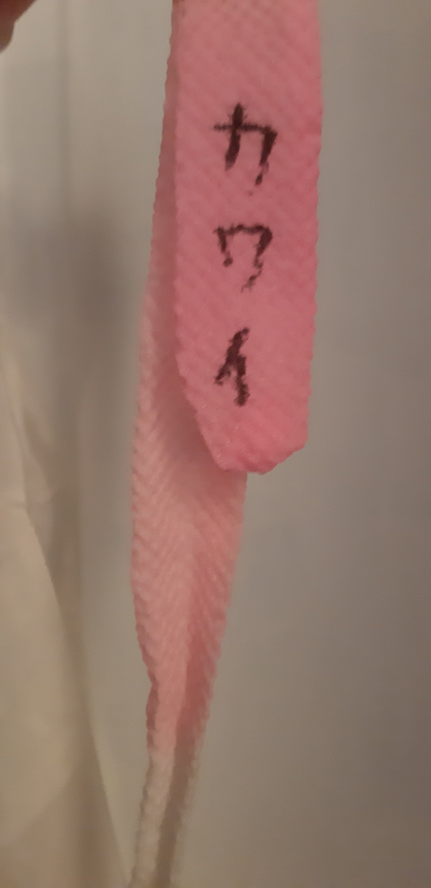 White robe with pink belt