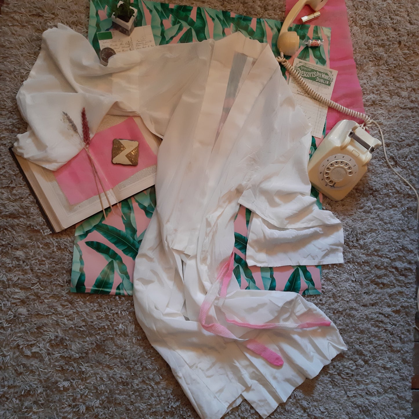 White robe with pink belt
