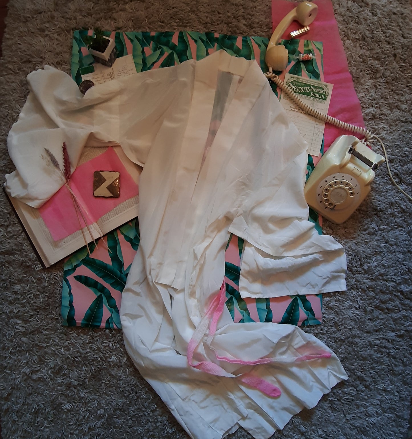 White robe with pink belt