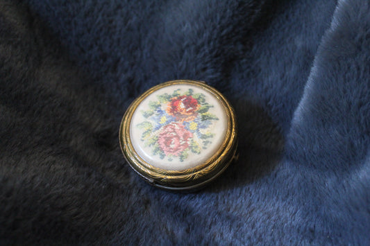 Gold basket compact with floral design