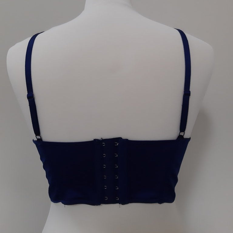 The image shows the back of an 8 Huit blue corset.