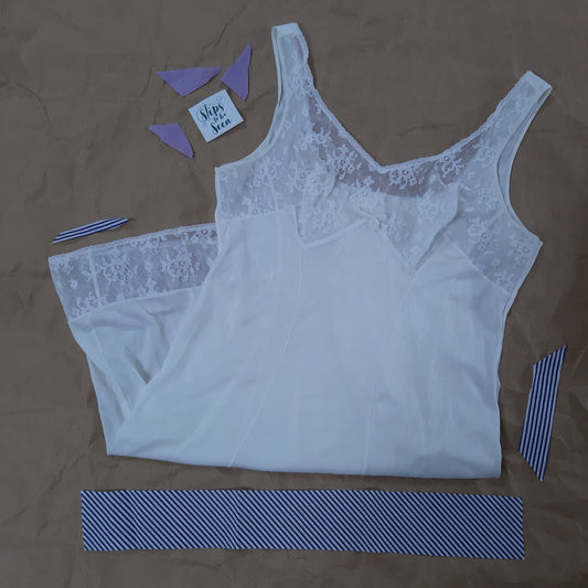 White slip with lace panels and bow