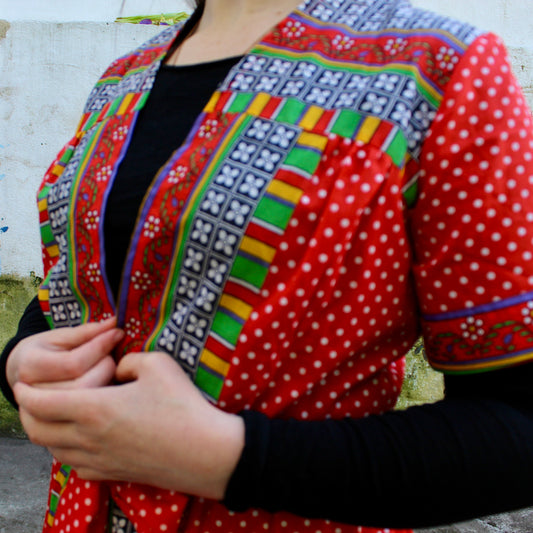 Red robe with white polkadot and floral panels