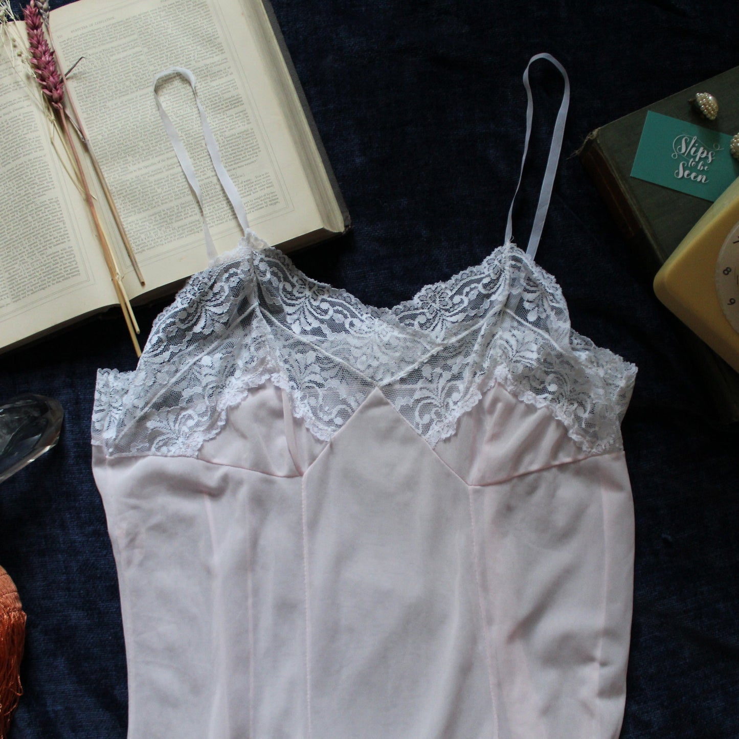 Delicate pastel peach slip with white lace