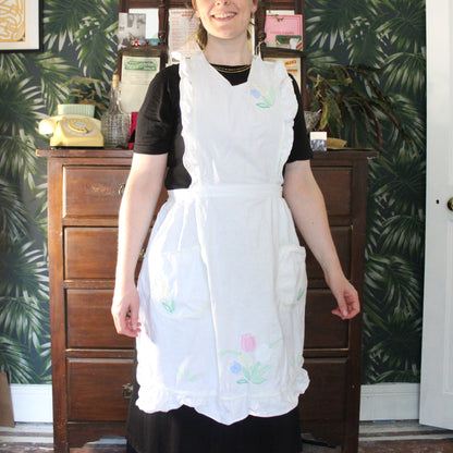 White frilly apron with floral panels