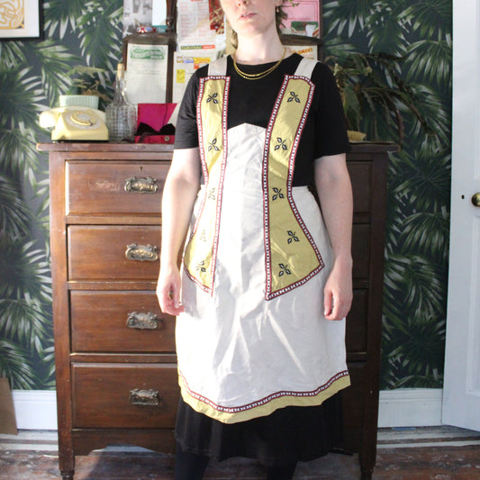 Canvas apron with mustard panel and holly print