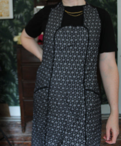 Black apron with white dot pattern