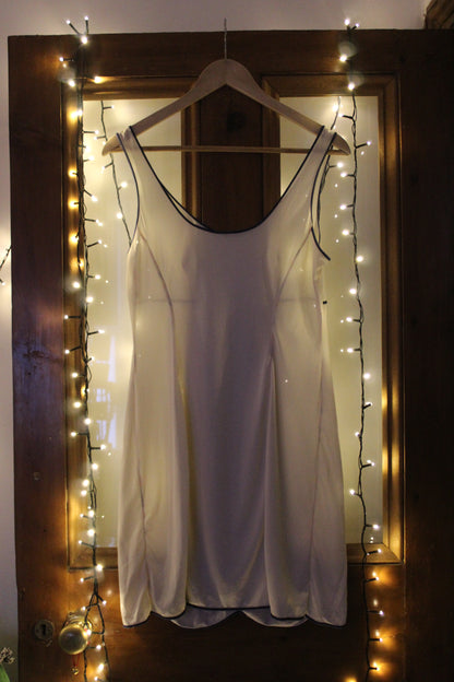 Ceramic white slip with blue piping and daisy trim