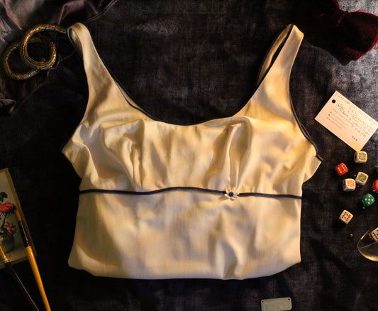 Ceramic white slip with blue piping and daisy trim