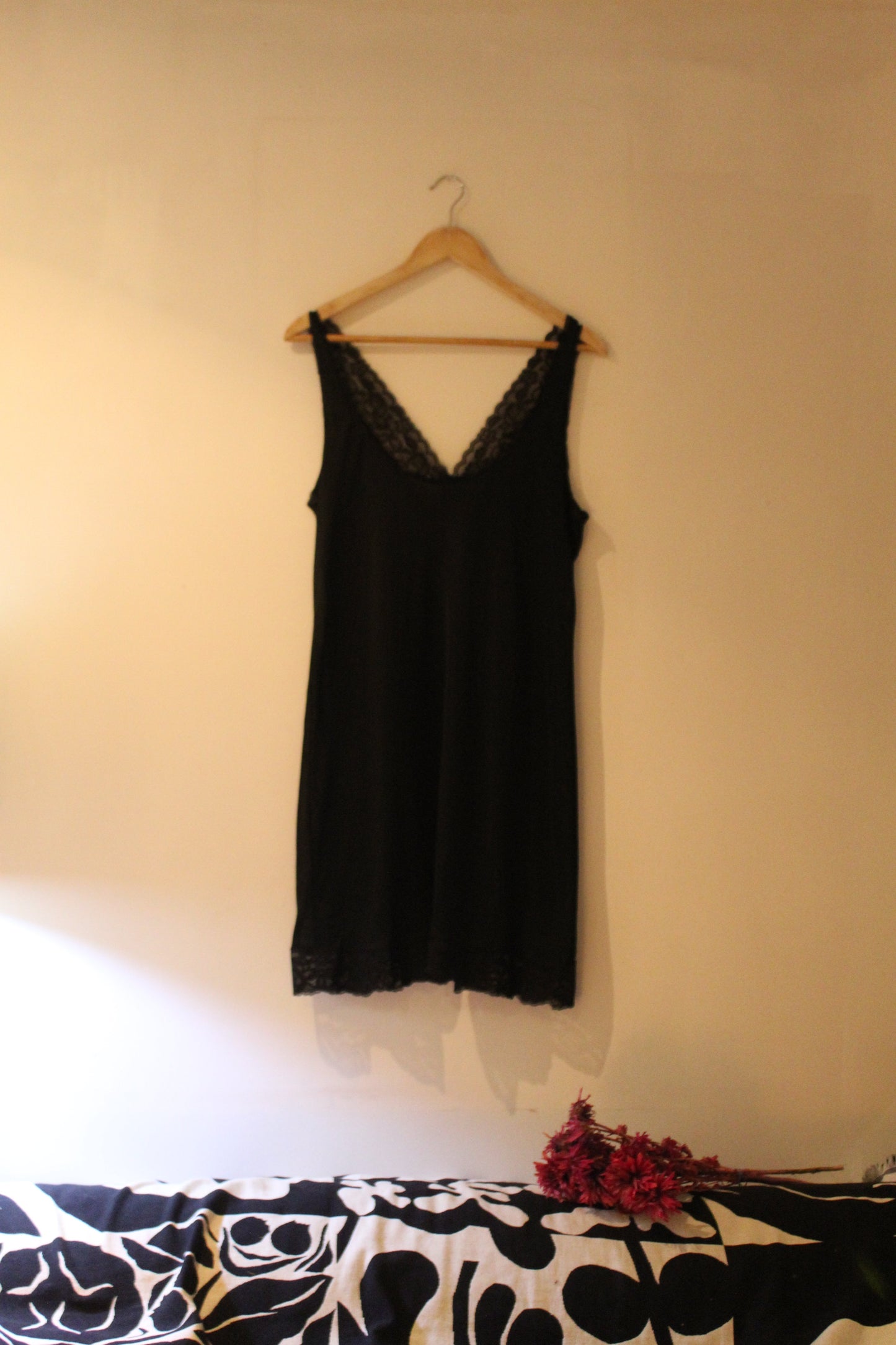 Short funky black slip with floral trims