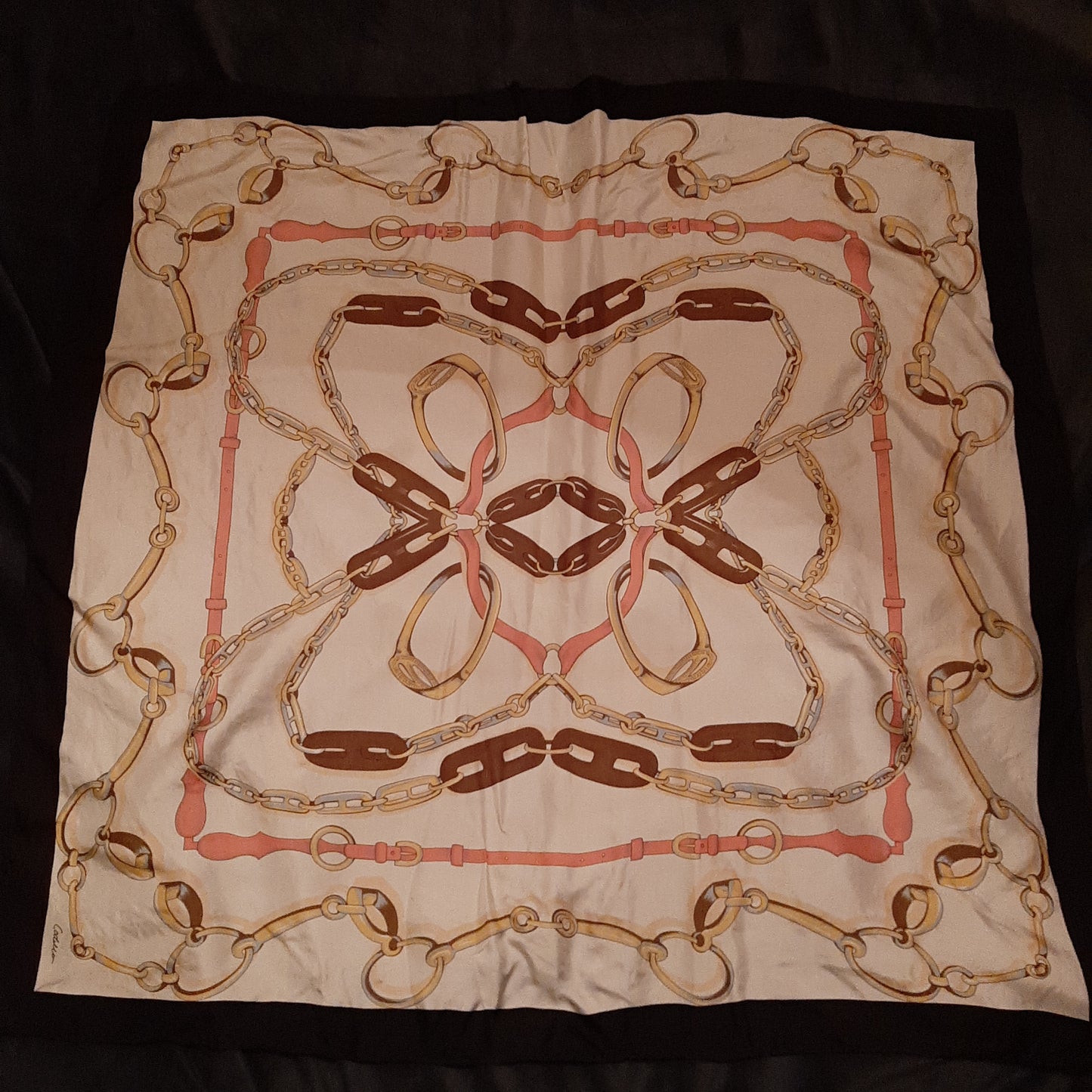Cream scarf with buckles and belt motif