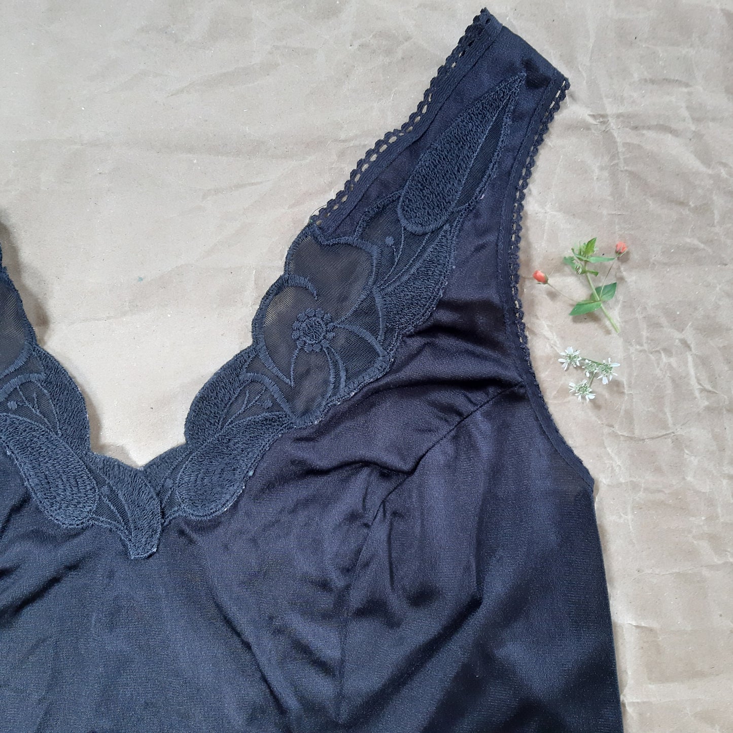 Black slip with woven floral trim