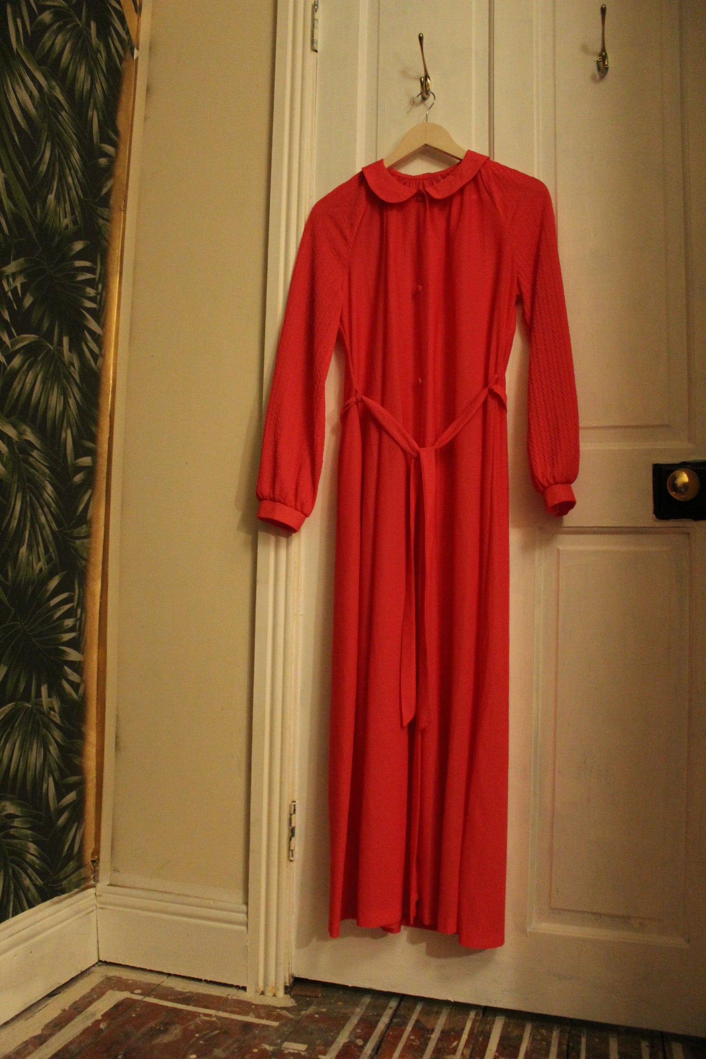 Coral pink robe with button up front and cuffed sleeves