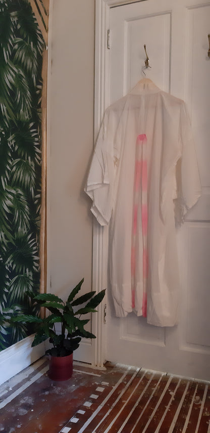 White robe with pink belt