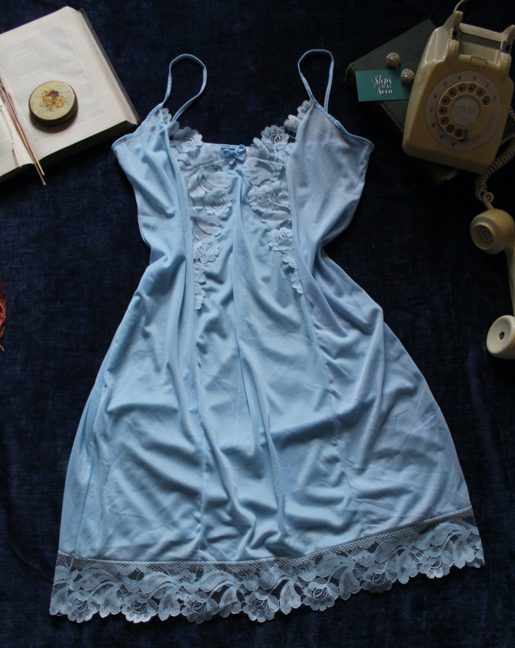 blue slip with floral trim and spaghetti straps
